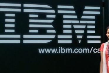Harpreet in front of IBM logo