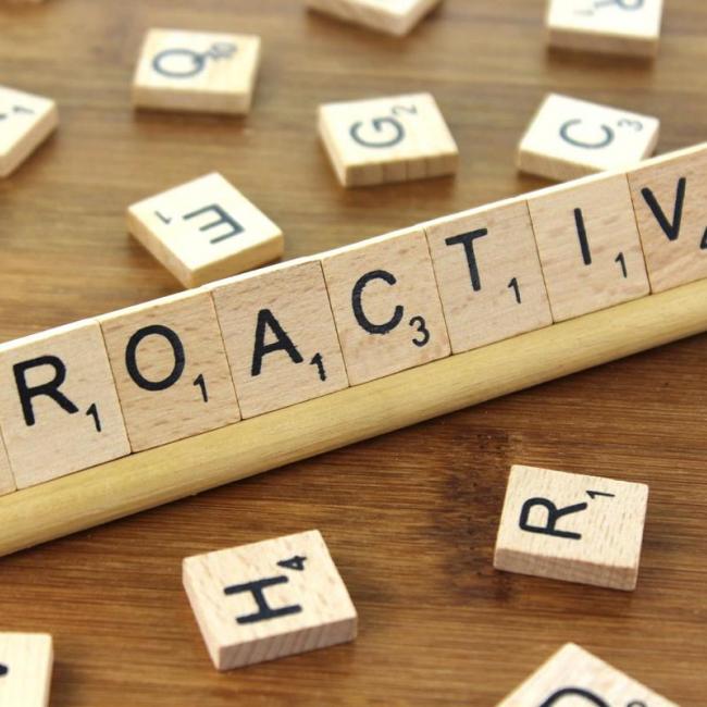 "Proactive" spelled with SCRAMBLE tiles 
