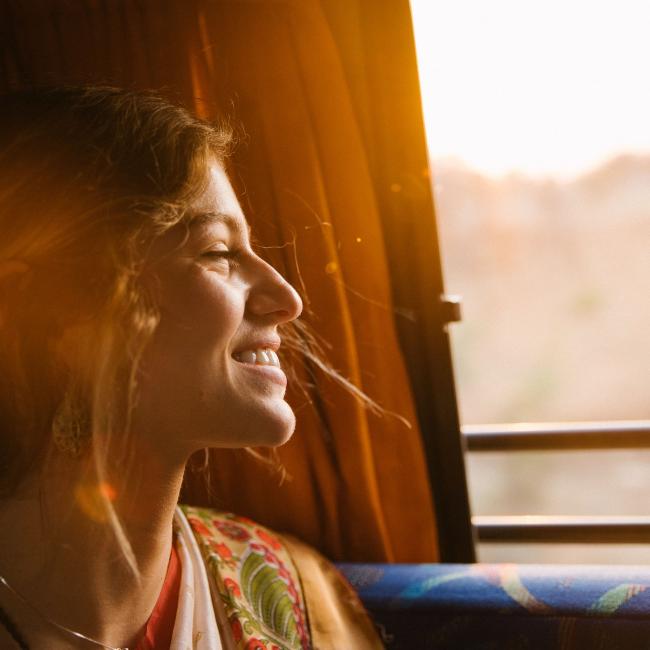 a woman smiling on the bus
