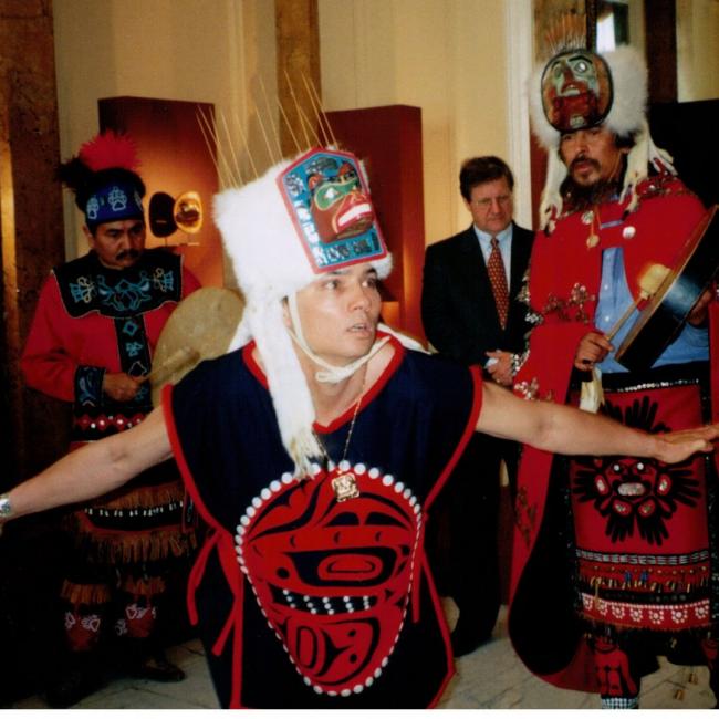 David in traditional clothing during a powwow