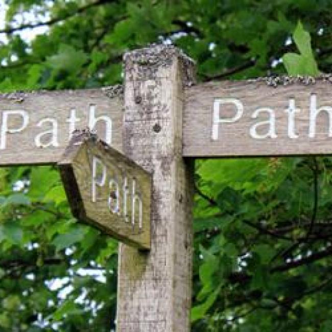 Direction post with path as the destinations