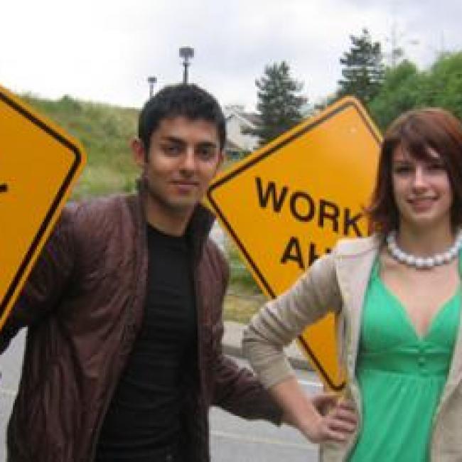 Students holding road signs
