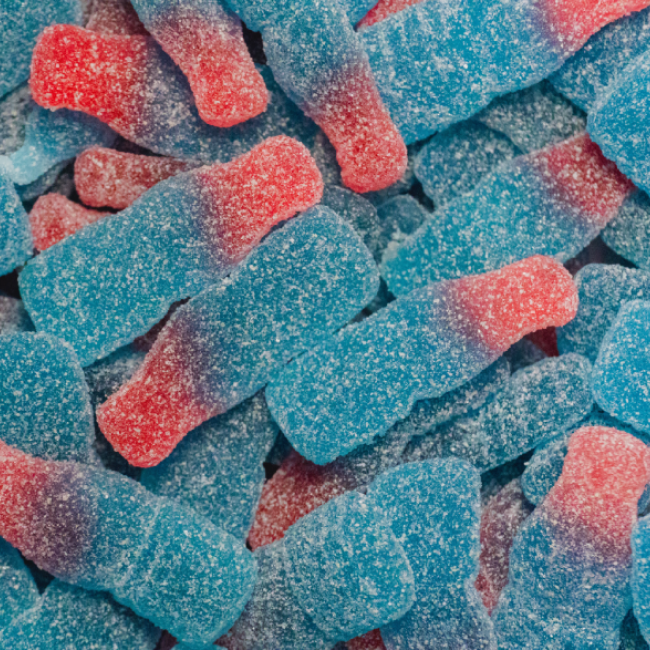 A pile of pink and blue gummy worms. 