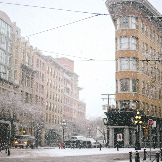 A picture of Vancouver's Gastown while snowing. 