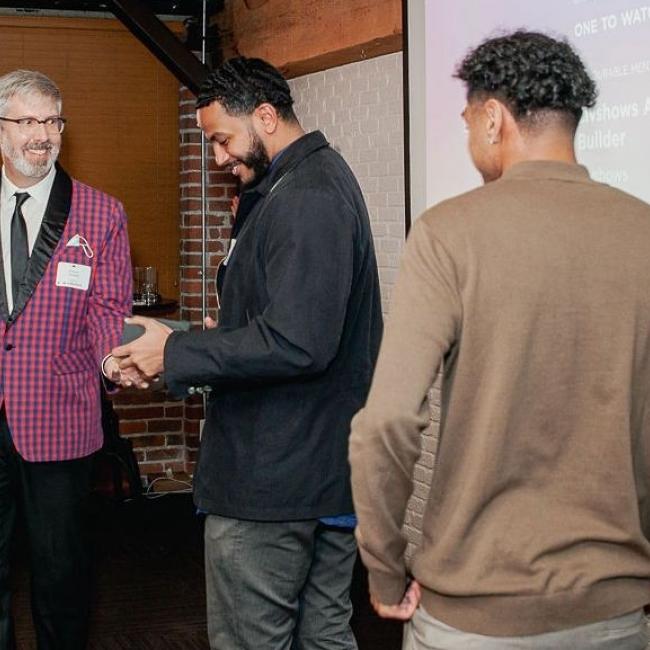 SIAT alumnus Bassam Mirghani being presented with his award at the 2021 Vancouver UX Awards