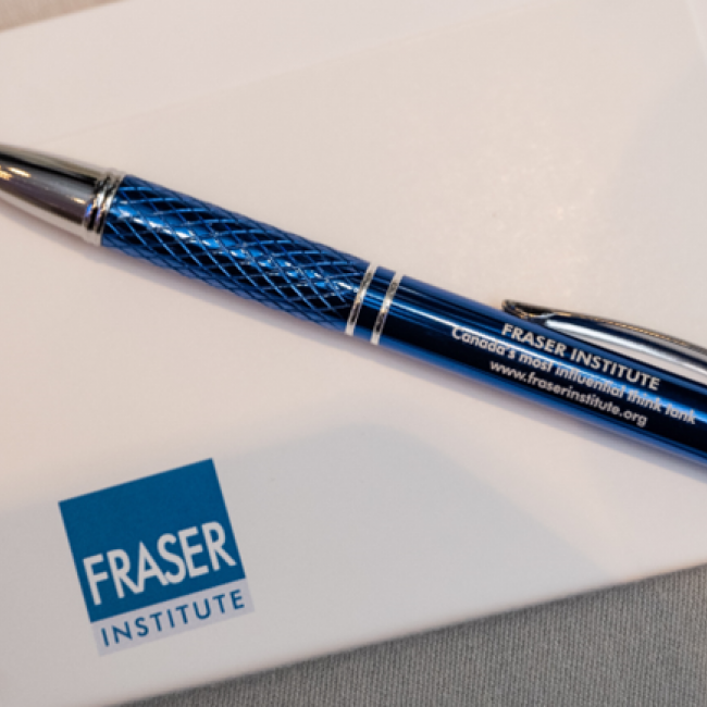 A pen over a paper with the Fraser Institute logo