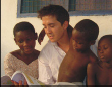 Neil and children in Ghana